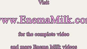 Busty ebony MILFs dive into wild milk enema fetish play.