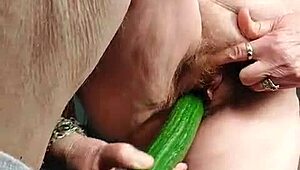 Granny fucks hairy slit with cucumber in raw action