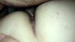 wife sits comfortably on the couch enjoying a relaxing moment