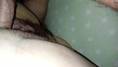 wife sits comfortably on the couch enjoying a relaxing moment