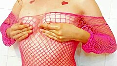 She slips into sexy fishnet lingerie