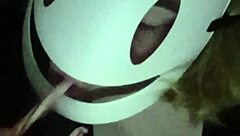 Petite girl gently caresses her natural big tits through black shirt and bra