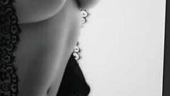 Dark curvy blonde poses nude in a simple photoshoot