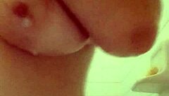 brunette bathing in the shower