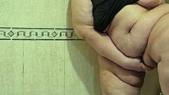 Intriguing mature woman pees and gets fucked by her dildo