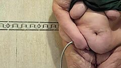 Intriguing mature woman pees and gets fucked by her dildo