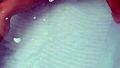 Amateur pornstar masturbates cock in hydro massage bathtub, focusing on sexy boobs