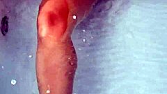 Amateur pornstar masturbates cock in hydro massage bathtub, focusing on sexy boobs