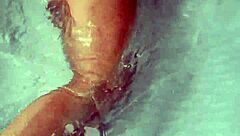 Amateur pornstar masturbates cock in hydro massage bathtub, focusing on sexy boobs