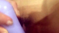 big purple dildo in a tight wet pussy.