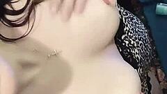 brunette babe clamps her nipples in close up view