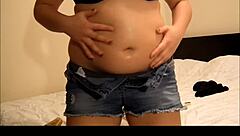 Chubby girl gives herself a lotion massage