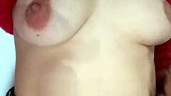 Playing with a belt, spanking my natural tits hard.