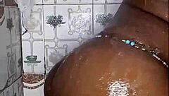 The black thick ebony woman fucks and dances in the shower