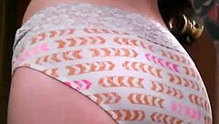 A tattooed woman enjoys solo time in the bathroom, exploring her body with gentle touches.