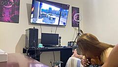 brunette sucking while he plays game