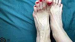 Footfetish with a new red pedicure