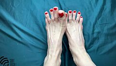 Footfetish with a new red pedicure