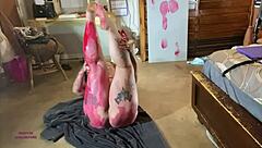 painted in red, bbw sally omalley stars in wild body art show. her curves steal the scene.