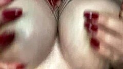 Curvy BBW oils up her big tits for solo massage