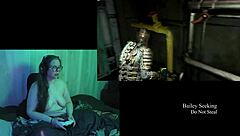 Naked brunette plays Deadspace with big natural tits