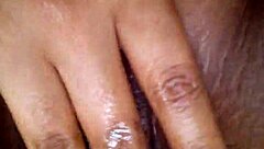 Black girl works her pussy with intense fingering