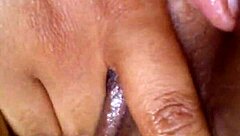 Black girl works her pussy with intense fingering