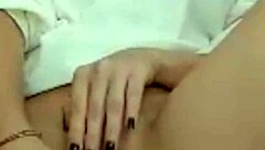 The hot brunette feels excited showing her wet pussy on webcam during masturbation.