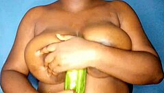 Ebony Woman Caresses Her Voluptuous Breasts