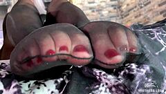 Goddess Teases Feet In Black Pantyhose Close-Up