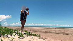 Watch my wife play football nude on the public clothed beach? She's flashing her big tits!