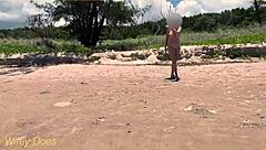 Watch my wife play football nude on the public clothed beach? She's flashing her big tits!