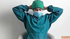 Nurse plays with latex gloves in hospital