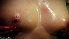 Milf gives a slick handjob and titfuck to her husband's huge cock