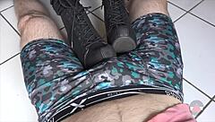 Resting her boots on my cock and balls