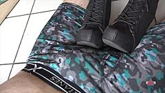 Resting her boots on my cock and balls