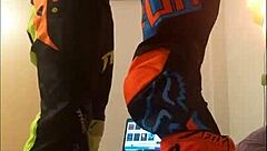 gay motocross rider gives blowjob in costume fetish.