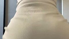 Curly-haired guy dancing funk with ass focus