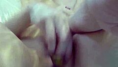 Sexy Nadia bathes with rubber duckies in solo relaxation