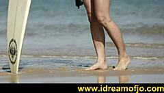 Brunette gay guy fingers himself on a sunny beach day