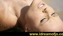 Brunette gay guy fingers himself on a sunny beach day