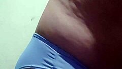 Gay guy tries on his underwear in a casual setting