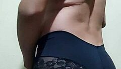 Gay guy tries on his underwear in a casual setting