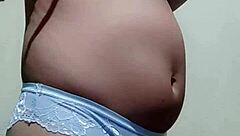 Gay guy tries on his underwear in a casual setting