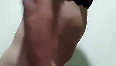 Gay guy tries on his underwear in a casual setting