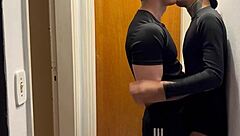 Young guys caught kissing hard on building camera footage