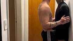 Young guys caught kissing hard on building camera footage