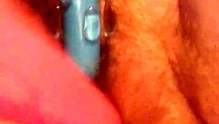 She rubs her hairy pussy again, building to cum.