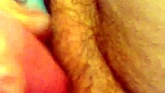 She rubs her hairy pussy again, building to cum.