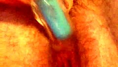 She rubs her hairy pussy again, building to cum.